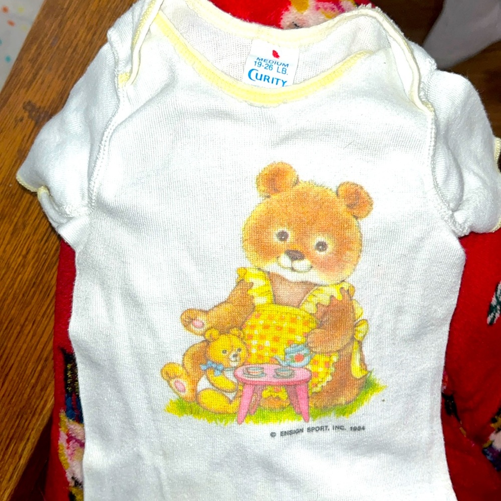 This is a Curity vintage baby girl shirt.